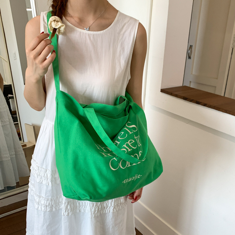 2025 autumn new bag letter embroidered canvas bag large capacity handbag Korean casual commuting bag student shoulder bag fashion designer crossbody b