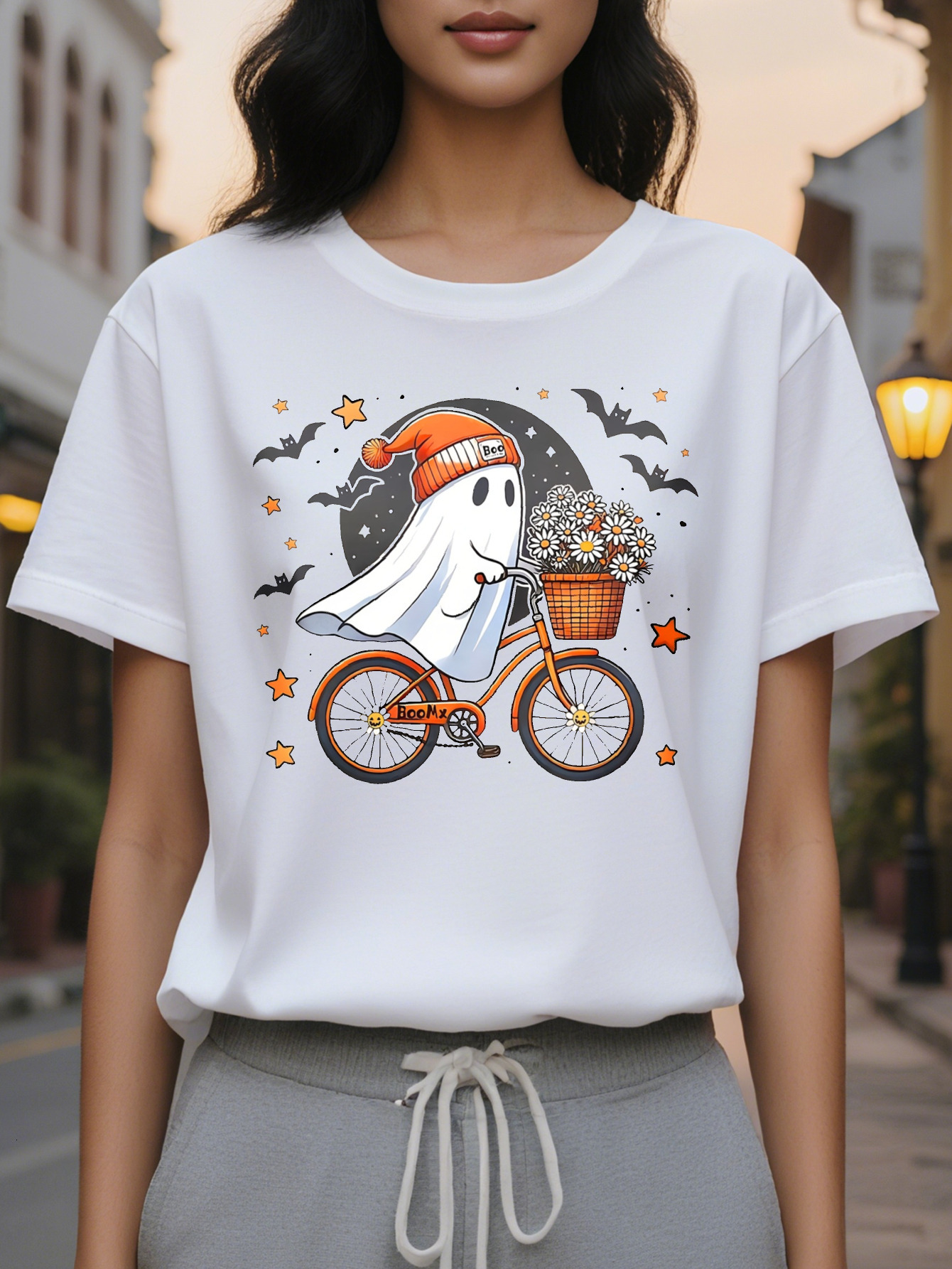 Women Graphic Tee Cute Ghost Riding Bike with Floral Basket Black Orange Design Casual Round Neck T-Shirt for