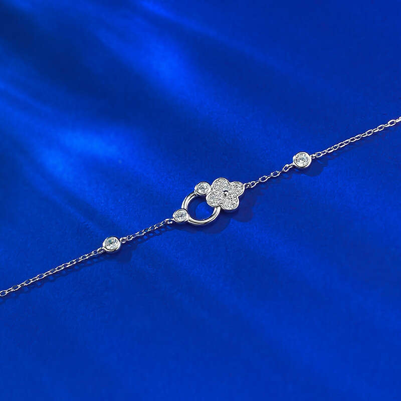 DH collections 925 Sterling Silver Lucky Four - leaf Clover Bracelet. This delicate and luxurious bracelet features trendy elements like row - set dia