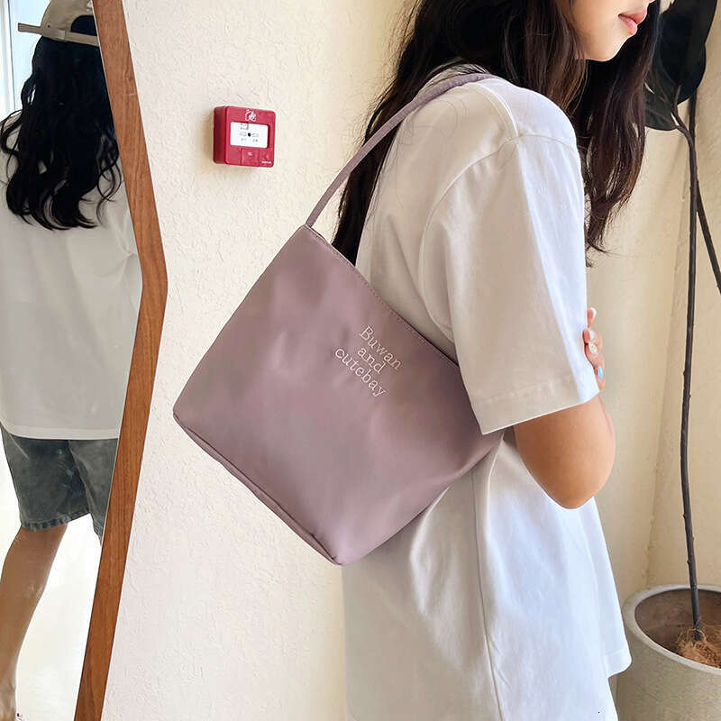 2025 Summer New Simple Nylon Underarm Korean Niche Design Letter Embroidery Handheld Commuter Bucket Bag
