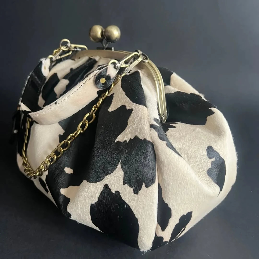 LOST IN VINTAGE Suede Cow Pattern Fabric Clutch Metal Frame Kiss Lock and Handle Puffy Purse 34x23x11cm Plush 250905