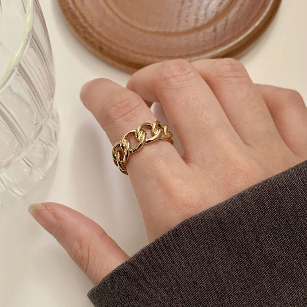 A fashionable hollowed-out ring for women, exuding a unique and high-end charm, with a distinctive and individualistic style. It's a closed-mouth