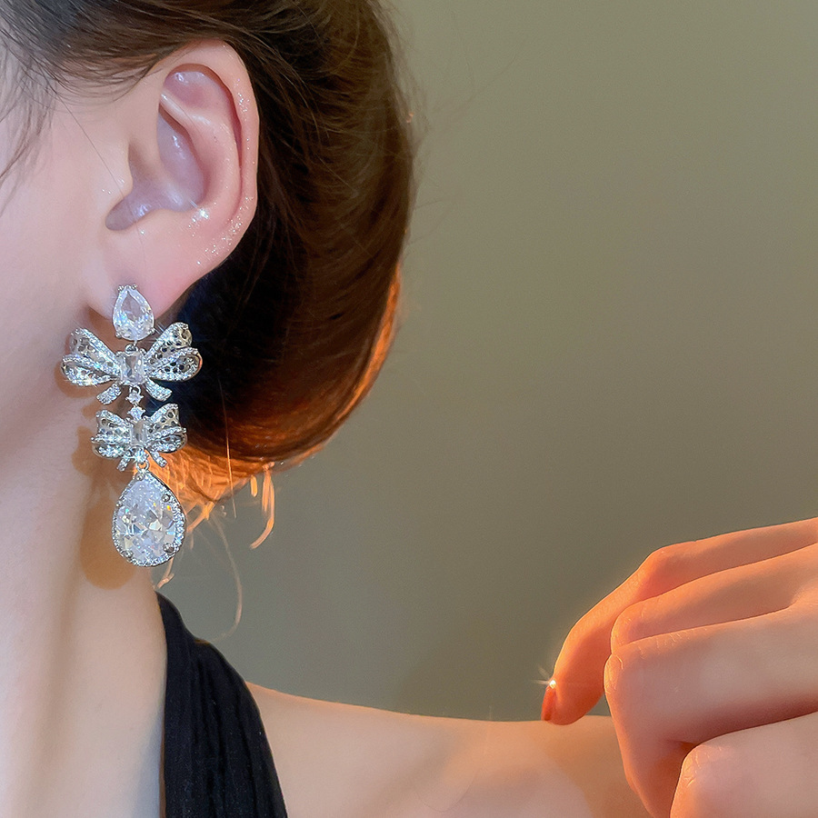 Silver Tone Bow & Teardrop Crystal Dangle Earrings With Dense Sparkling Crystal Detailing Luxury Glamorous Style Party & Evening Occasion Wear Gift Fo