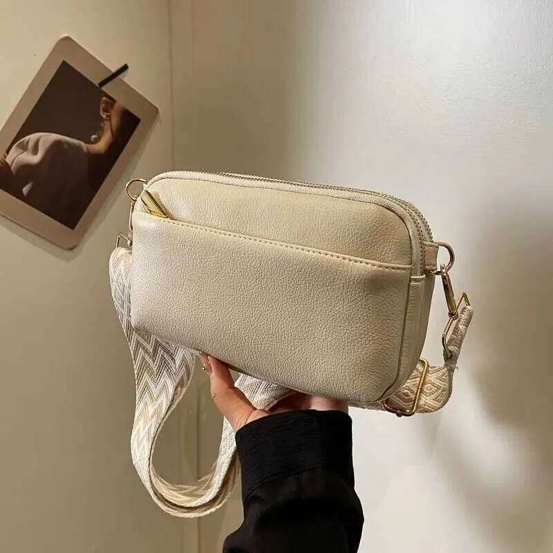 This Is A Super Practical Messenger Bag Fashion Wide Shoulder Strap Design Suitable For Going Out Shopping