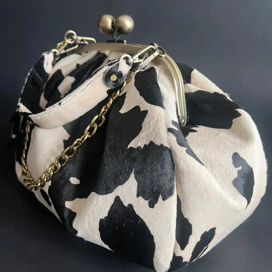 LOST IN VINTAGE Suede Cow Pattern Fabric Clutch Metal Frame Kiss Lock and Handle Puffy Purse 34x23x11cm Plush 250905