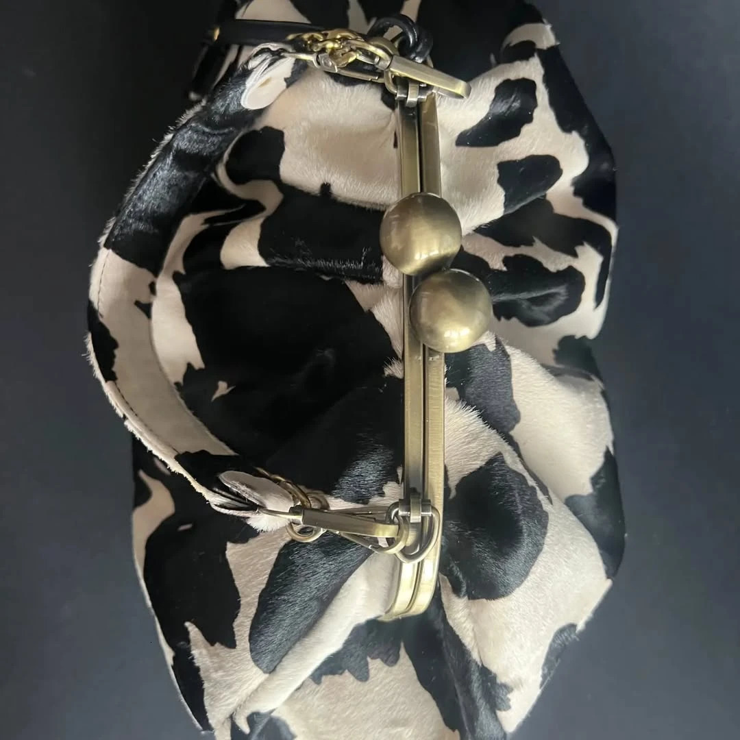 LOST IN VINTAGE Suede Cow Pattern Fabric Clutch Metal Frame Kiss Lock and Handle Puffy Purse 34x23x11cm Plush 250905