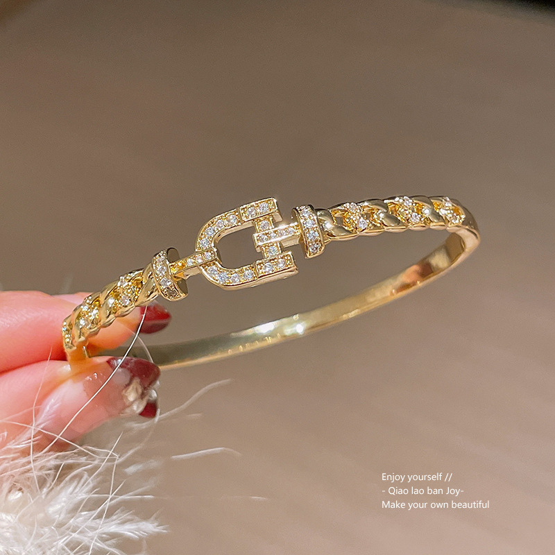 Gold Tone Bangle With Signature Buckle Motif, Sparkling Crystal Detailing & Braided Chain Texture Luxury Elegant Style Daily & Formal Wear Gift For He
