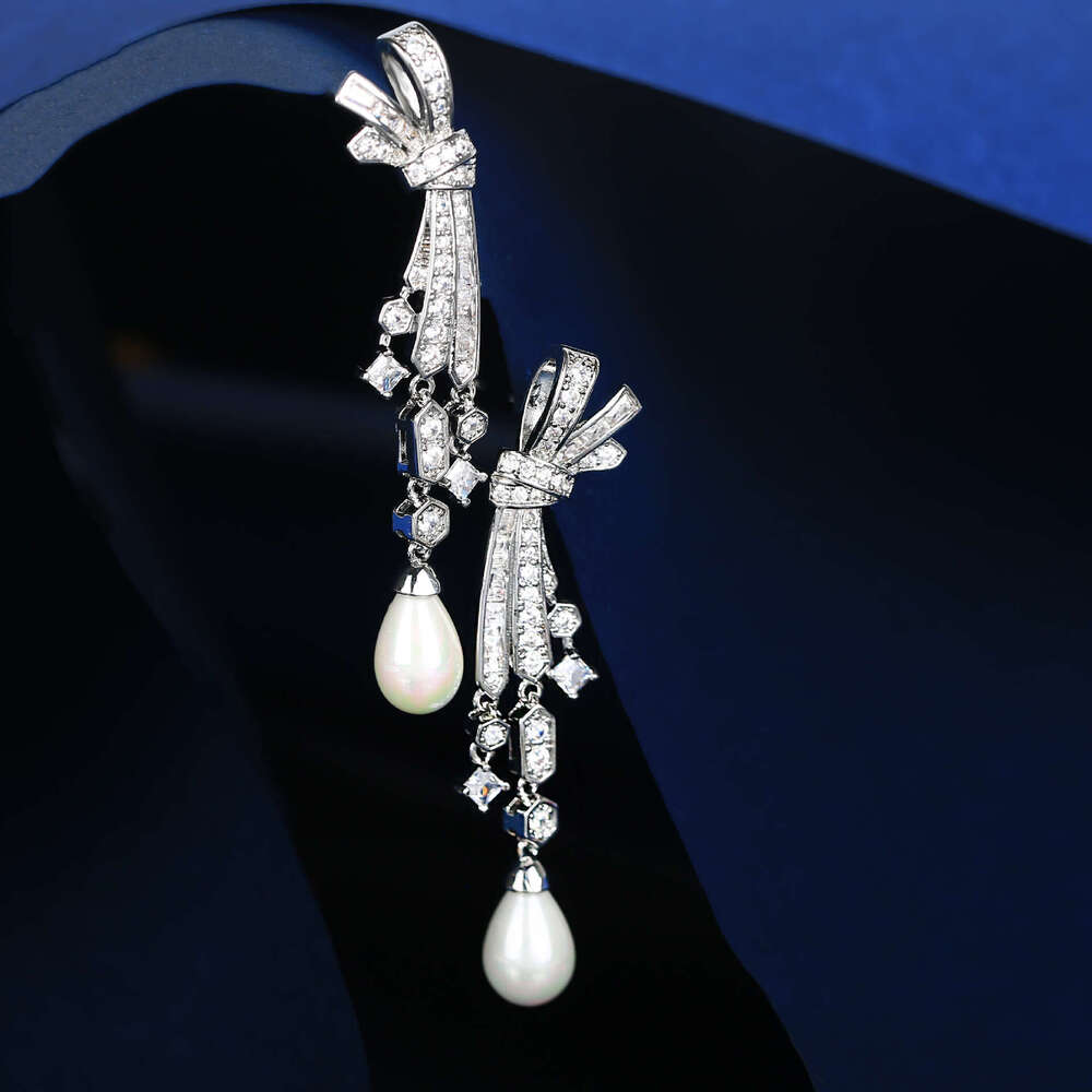 DH collections: Otina Bowknot Tassel Pearl Shape Studs for Women Sier Needle Light Fashion Elegant Earrings