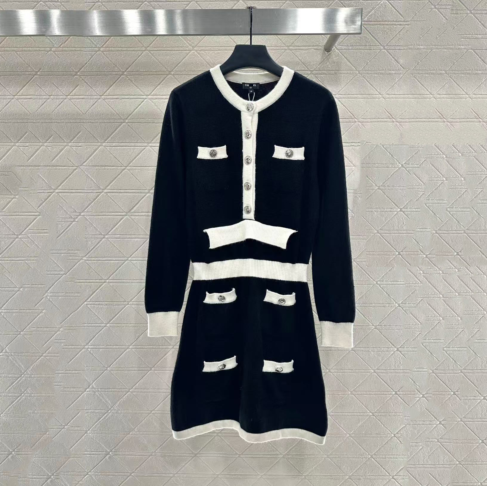 2026 New Women's Dress with Metal Button Sleeve Knitted Long Skirt Fashion Black and White Splicing Style