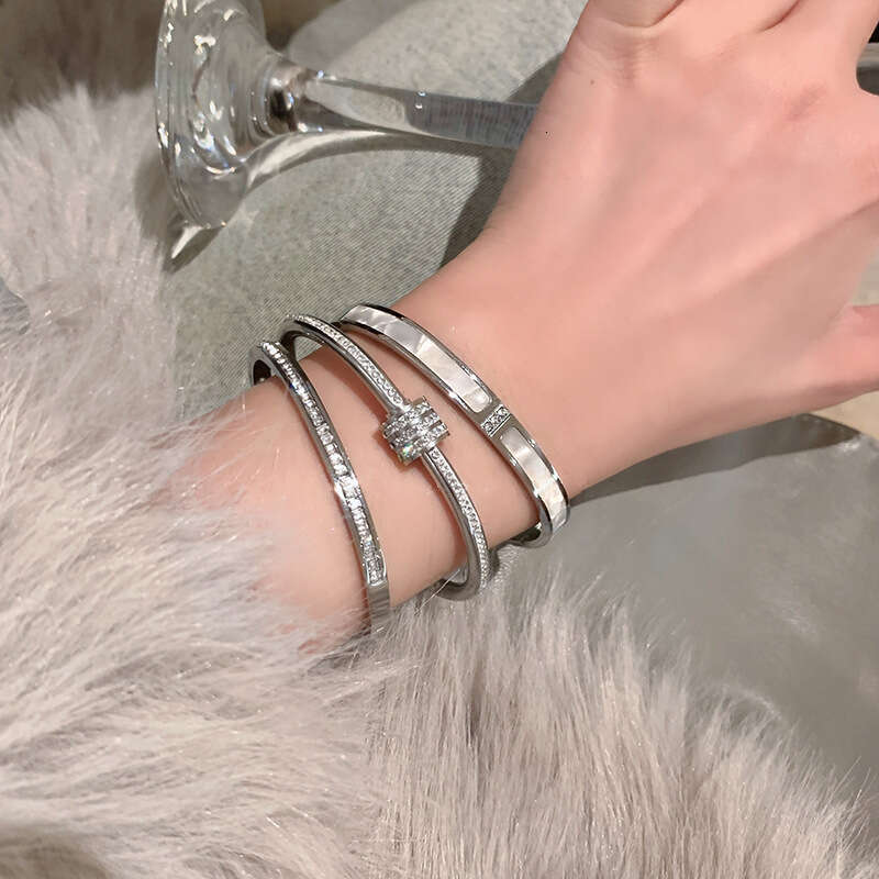 DH collections: High - end White Mother - of - Pearl Bracelets for Women - Sparkling Diamond - set Stainless - steel Jewelry