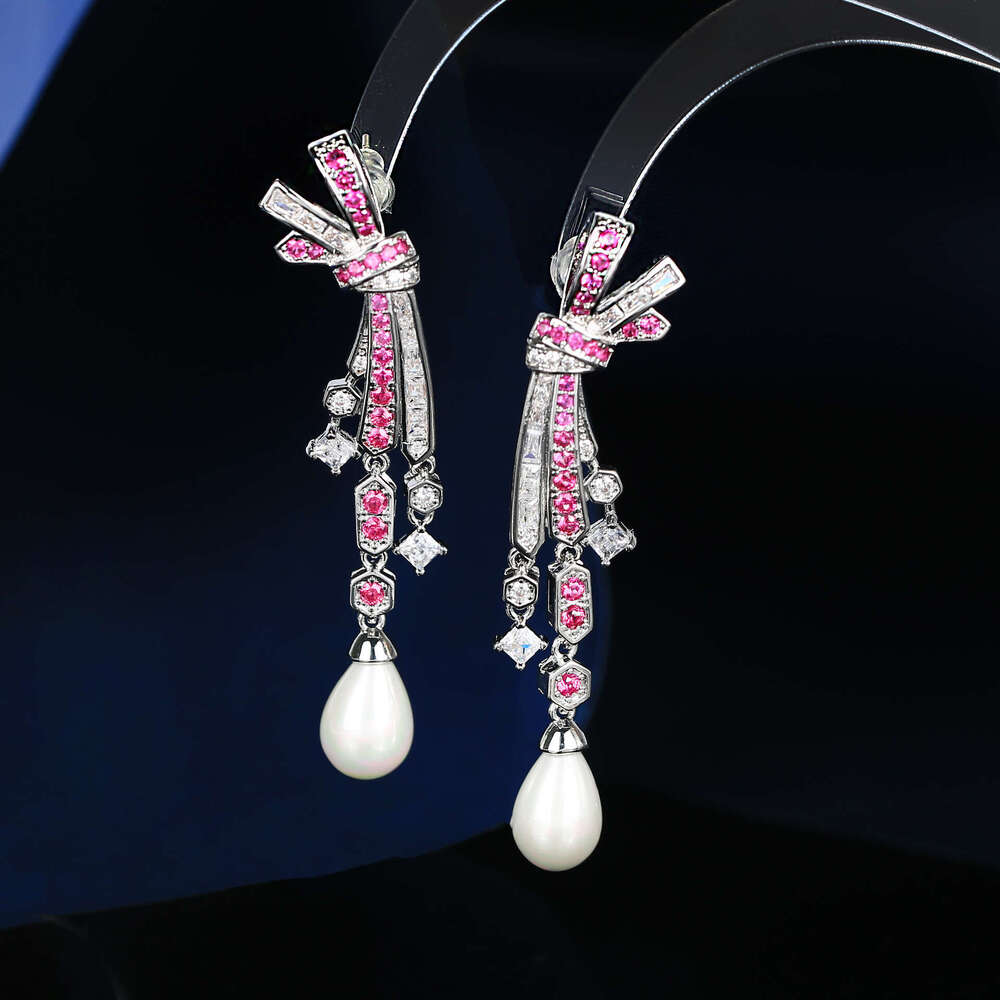 DH collections: Otina Bowknot Tassel Pearl Shape Studs for Women Sier Needle Light Fashion Elegant Earrings