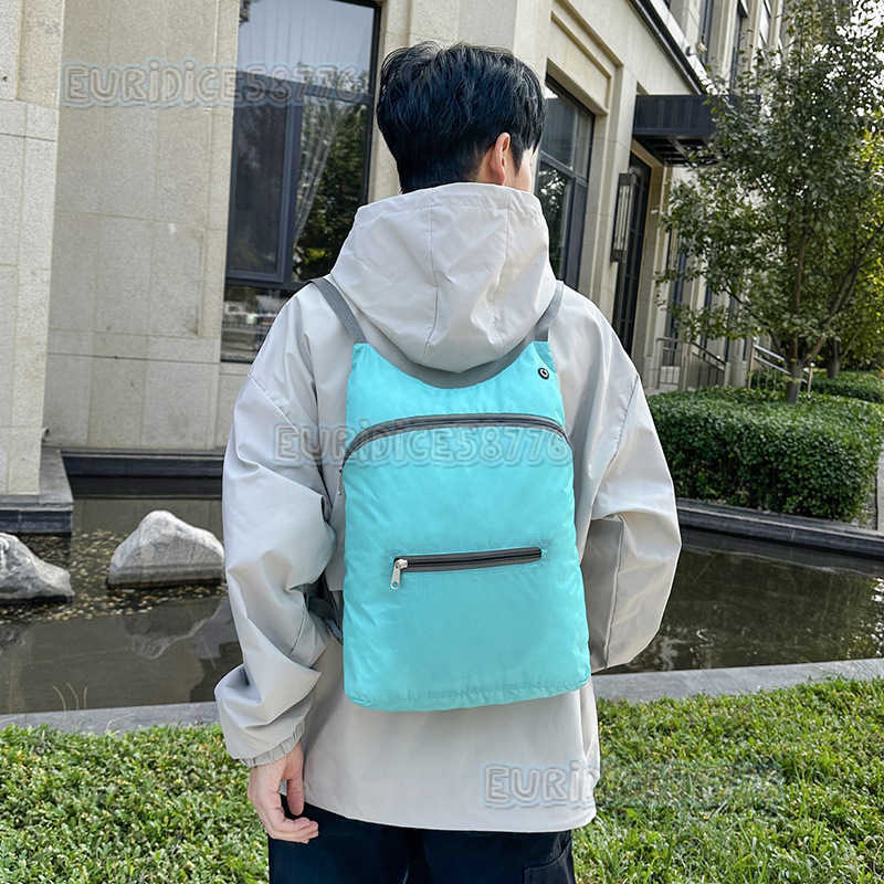 Skin Bag Large Capacity Ultralight Portable Folding Bag Mens Sports Backpack with Earphone Outdoor Travel Backpack H250906