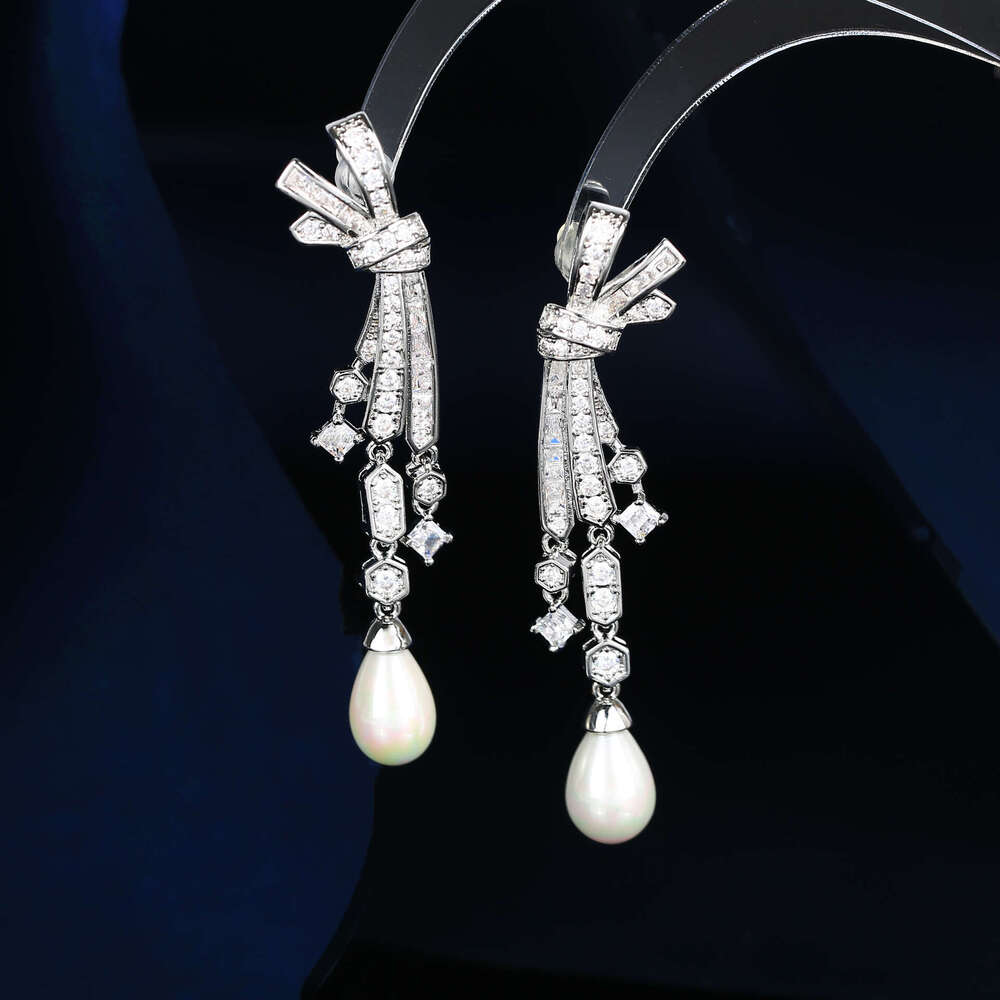 DH collections: Otina Bowknot Tassel Pearl Shape Studs for Women Sier Needle Light Fashion Elegant Earrings