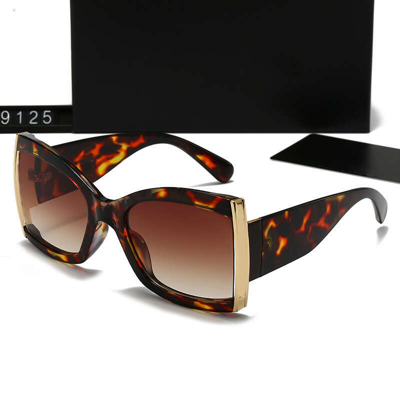 New Women's Fashion Trend Metal Leg Hollow Sunglasses UV Protection 9125 99a