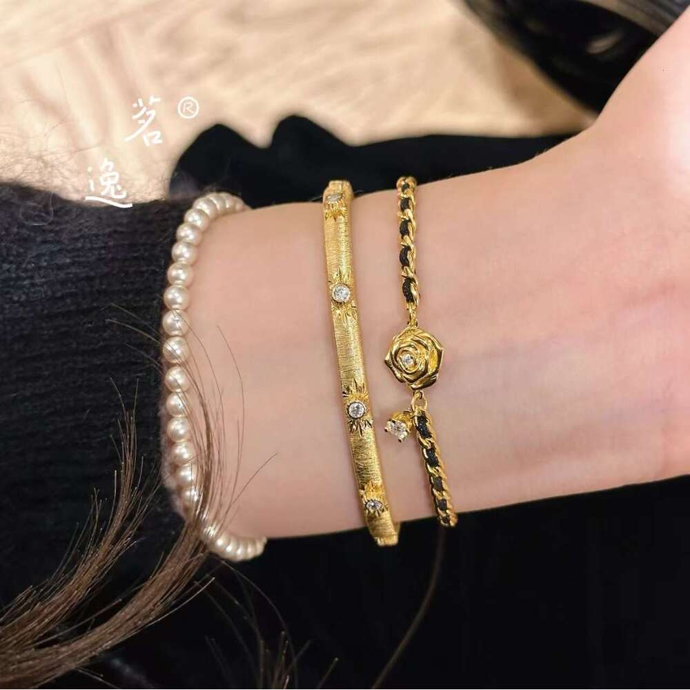 DHEssentials Nano Vacuum Coated Camellia Bracelet - Women's Luxury Black Gold Leather Cord Weave Court Style Accessory