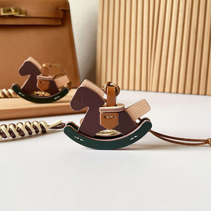 DHEssentials New Creative Rocking - horse PU Bag Hangers: Cute Decor for Bags & Cars