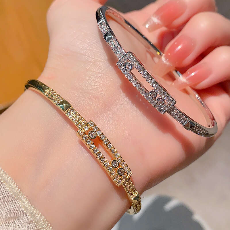 Gold Tone Luxury jewelry designer micro inlaid 5A zircon versatile three diamond sliding hollow stacked single row tennis bracelet - view 3