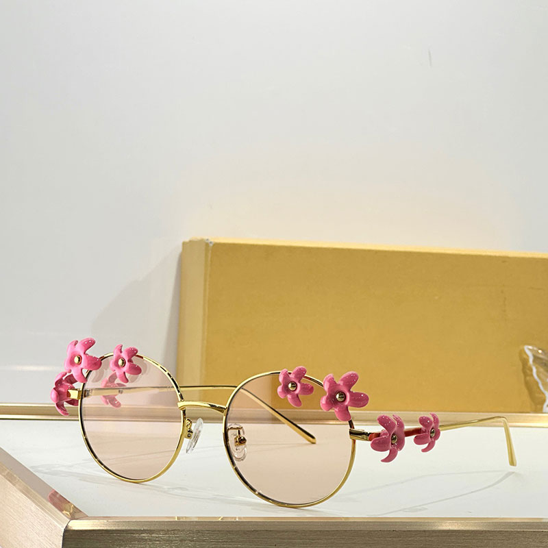 Ladies oval metal sunglasses daisy embellishments New fashion designer womens elliptic glasses Outdoor personality UV400 40173
