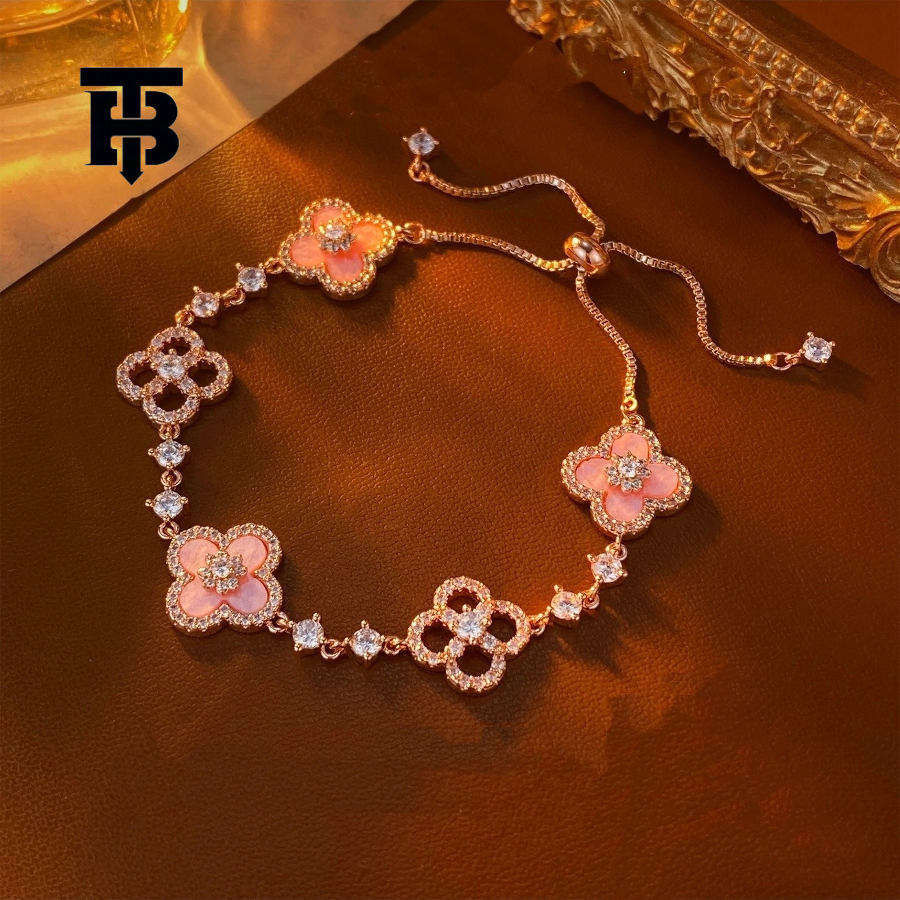 TB BHULAMTE Free Shipping New Designer Accessory Exquisite Diamond Inlay Shiny Imitation Natural Powder Shell Hollow Lucky Clover Pull Bracelet