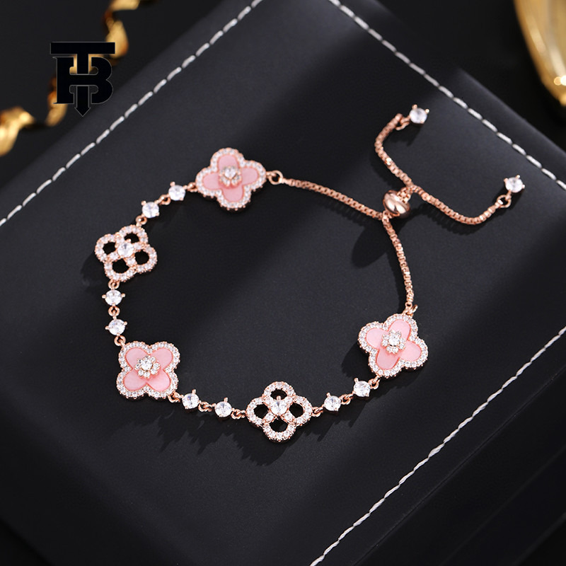 TB BHULAMTE Free Shipping New Designer Accessory Exquisite Diamond Inlay Shiny Imitation Natural Powder Shell Hollow Lucky Clover Pull Bracelet