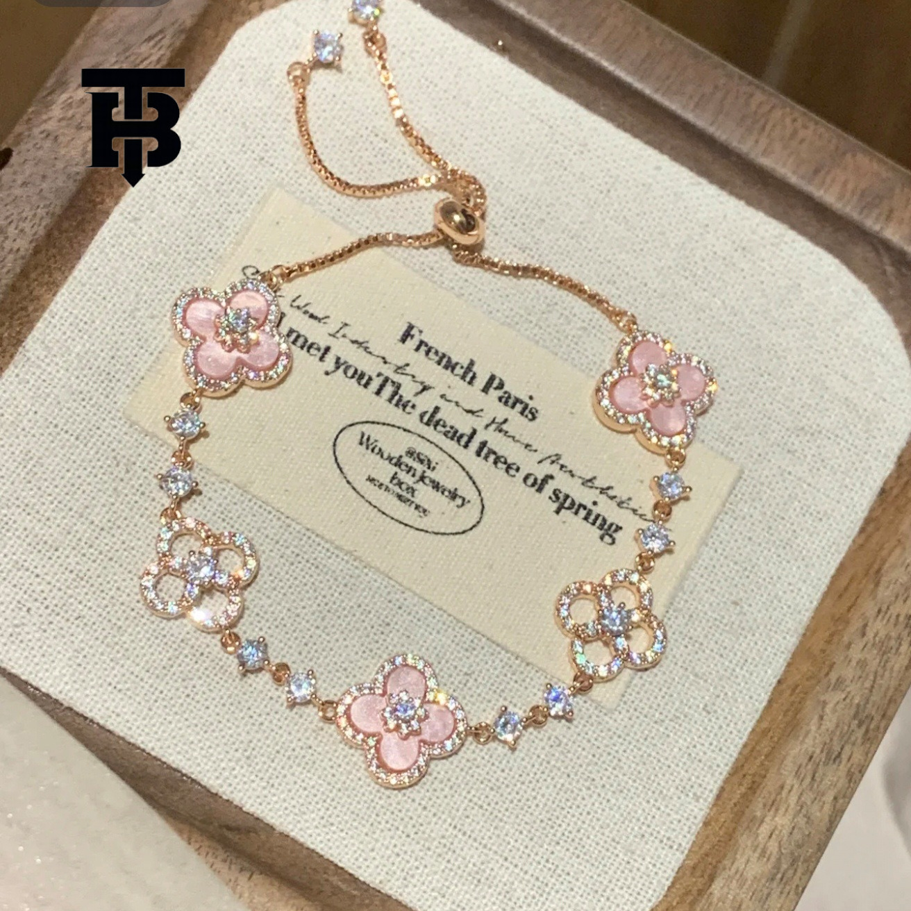 TB BHULAMTE Free Shipping New Designer Accessory Exquisite Diamond Inlay Shiny Imitation Natural Powder Shell Hollow Lucky Clover Pull Bracelet