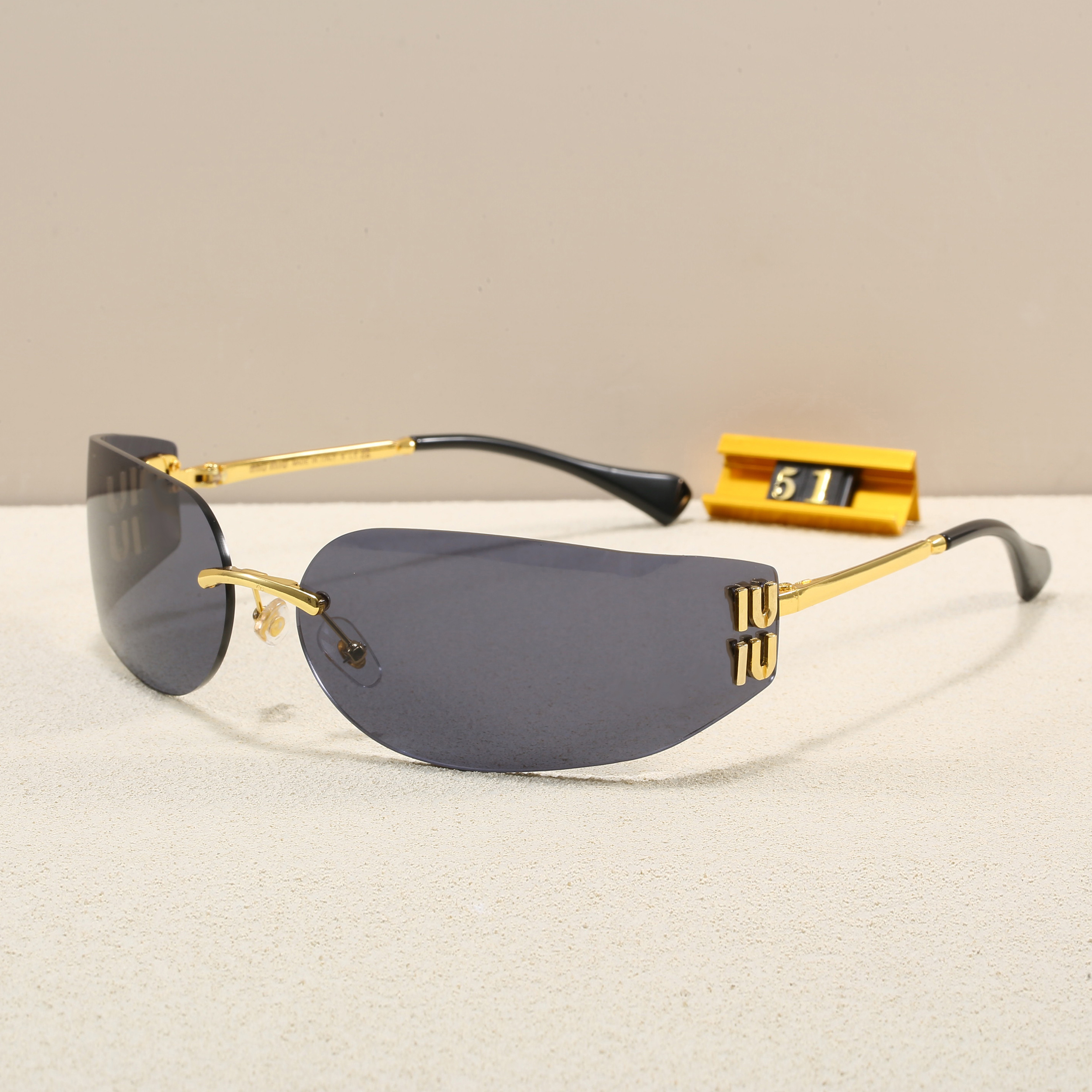 Luxury Designer Rimless sunglasses for women men fashion Goggle Sun protection for driving Beach shading UV protection polarized glasses gift with box goods nice