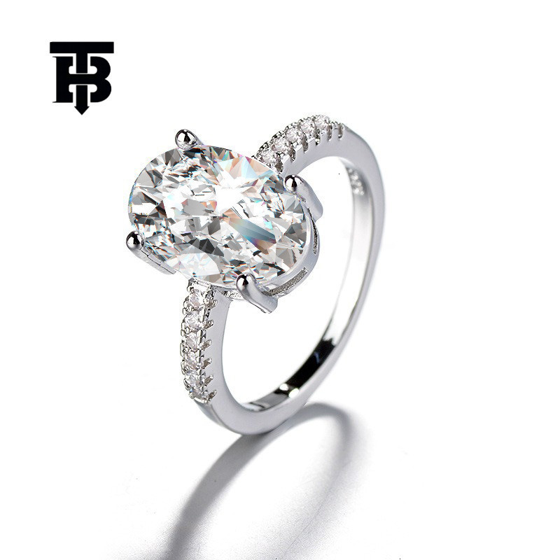 TB BHULAMTE Free Shipping New Designer Accessories Luxury Four Fork Imitation Moissanite Diamond Ring Large Oval Pigeon Egg Ring For Women