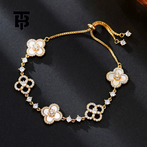 TB BHULAMTE Free Shipping New Designer Accessory Exquisite Diamond Inlay Shiny Imitation Natural Powder Shell Hollow Lucky Clover Pull Bracelet