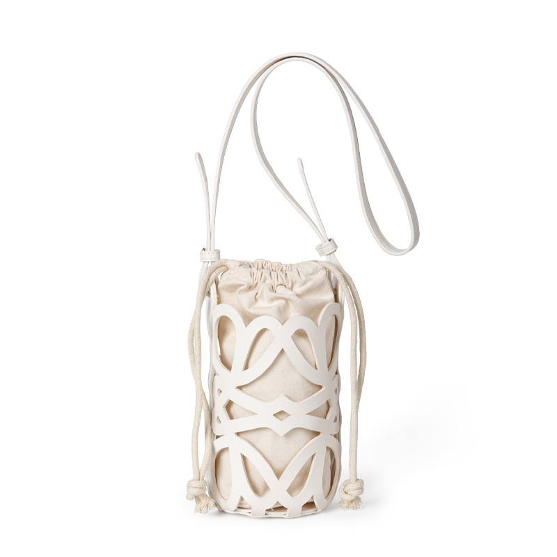 2025 New Korean niche design hollow-out drawstring canvas cylindrical crossbody bag for women high-end unique versatile shoulder bag