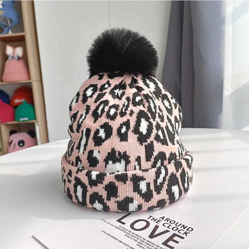 Tren new autumn and winter simulation leopard print large wool ball pulr knitted hat for couples stylish and versatileXJ250910