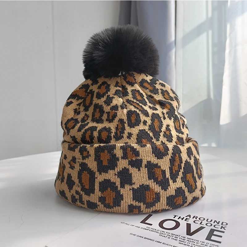 Tren new autumn and winter simulation leopard print large wool ball pulr knitted hat for couples stylish and versatileXJ250910
