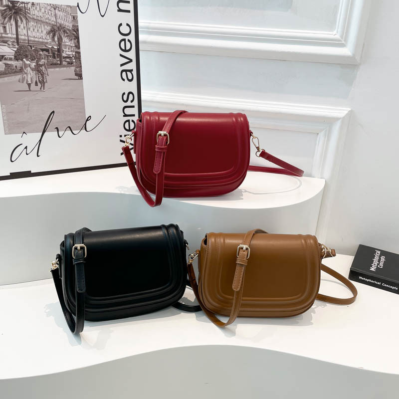 Free shipping designer 2025 New Saddle Bag Hot Fashion Trend Versatile Shoulder Bag Crossbody Bag Women Underarm Bag Flap Small Square Bag
