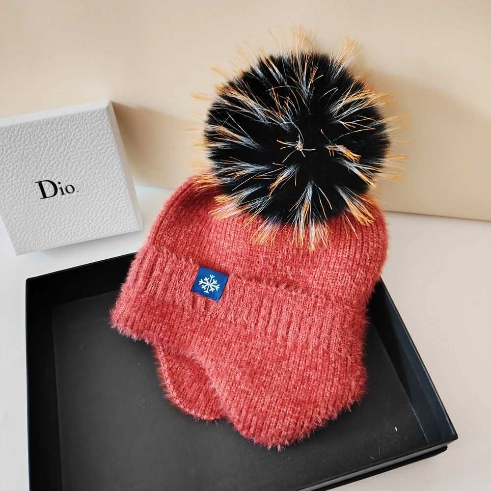 Hot selling couple ear protection hat can color scheme fashionable artificial large wool ball knitted hat Christmas skiingXJ250910