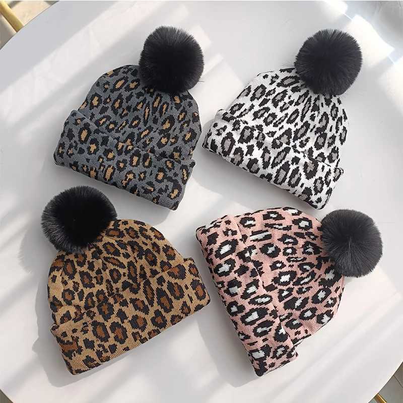Tren new autumn and winter simulation leopard print large wool ball pulr knitted hat for couples stylish and versatileXJ250910