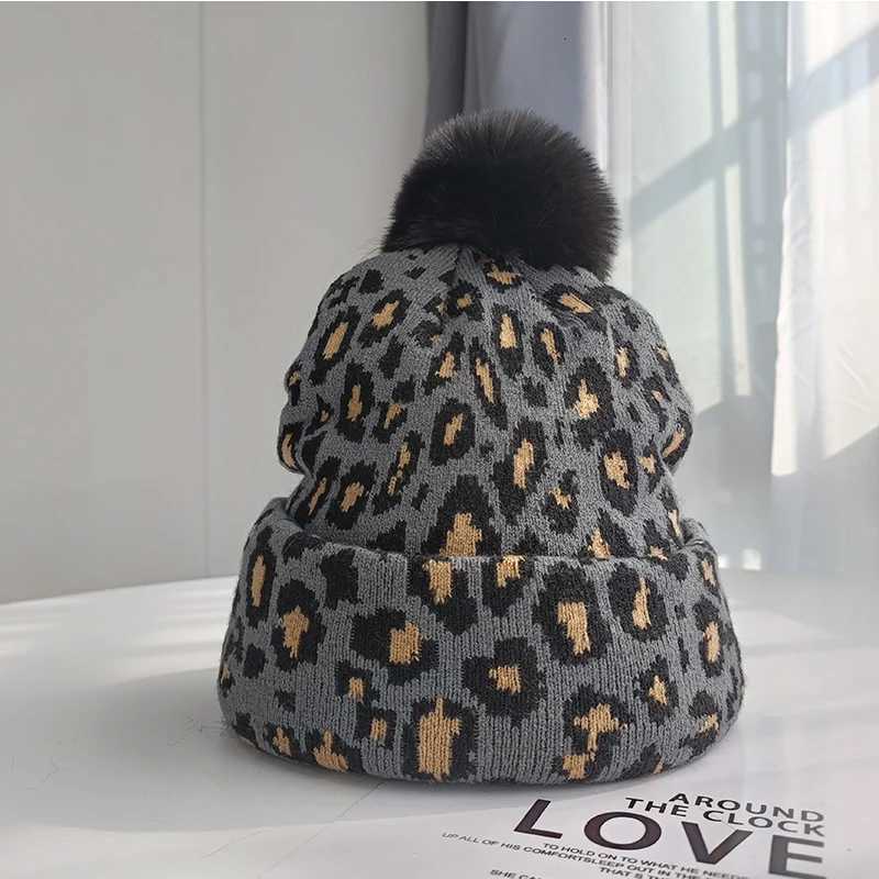 Tren new autumn and winter simulation leopard print large wool ball pulr knitted hat for couples stylish and versatileXJ250910