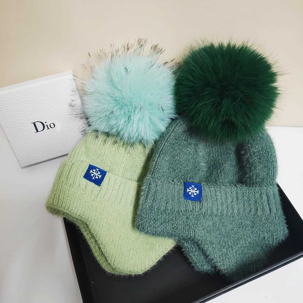 Hot selling couple ear protection hat can color scheme fashionable artificial large wool ball knitted hat Christmas skiingXJ250910