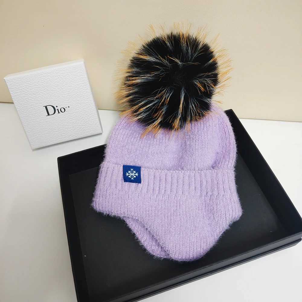 Hot selling couple ear protection hat can color scheme fashionable artificial large wool ball knitted hat Christmas skiingXJ250910