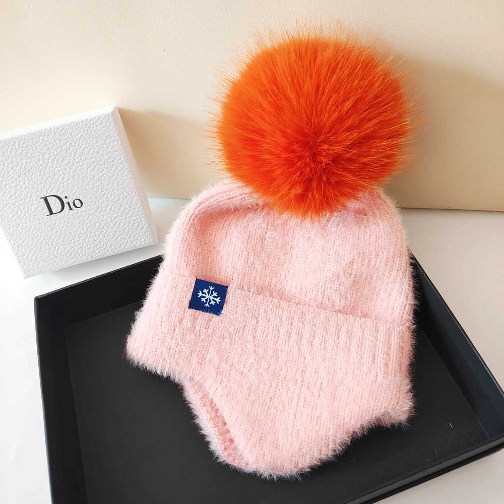Hot selling couple ear protection hat can color scheme fashionable artificial large wool ball knitted hat Christmas skiingXJ250910