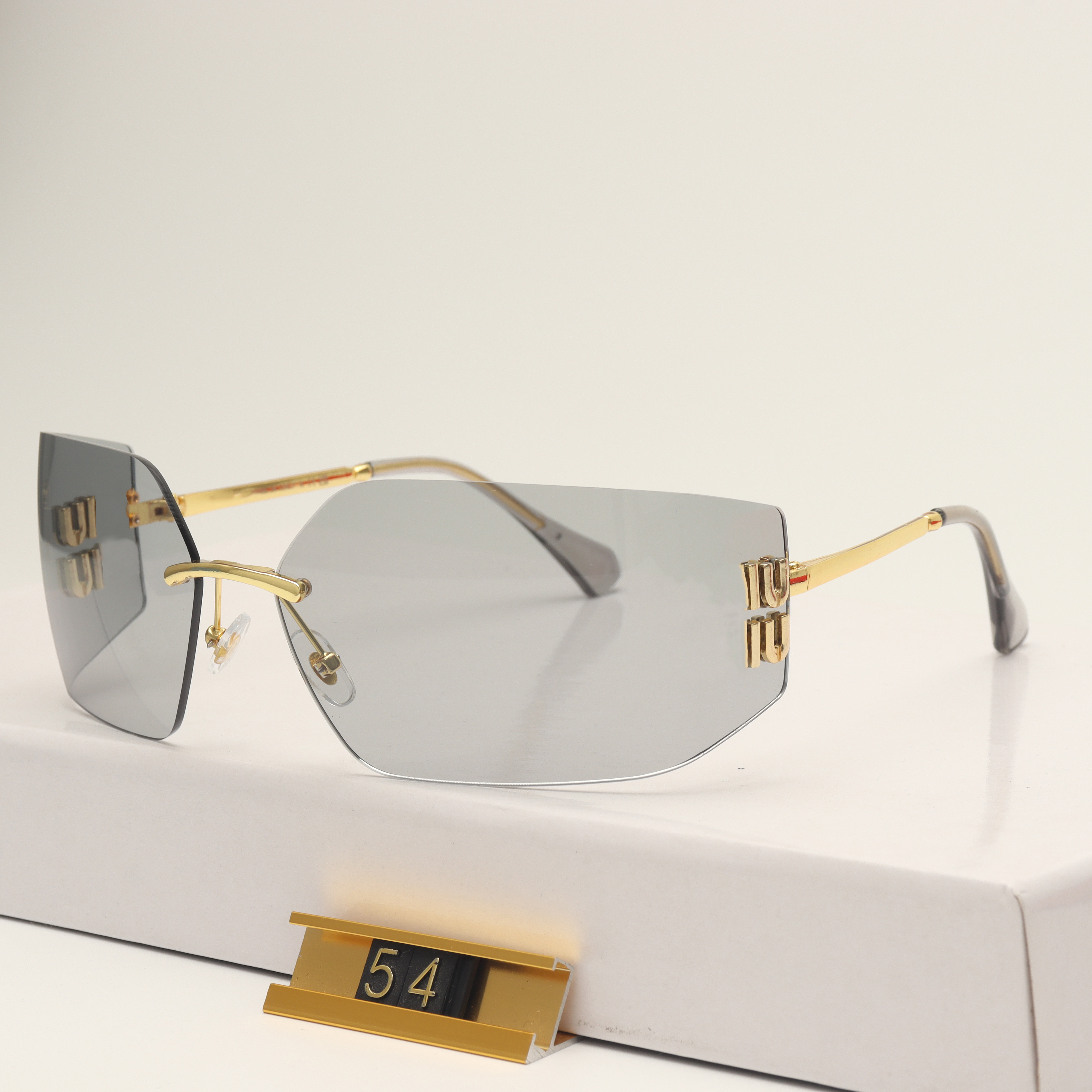 Luxury Designer witch Rimless sunglasses for women men fashion Goggle Sun protection for driving Beach shading UV protection polarized glasses gift with box nice