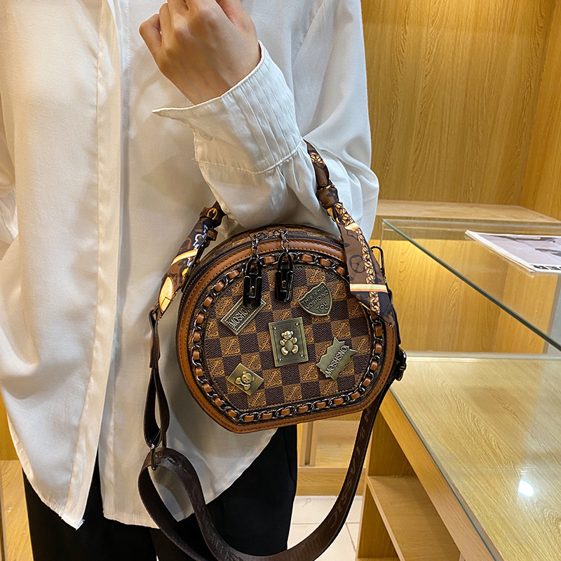 Free shipping designer bag Fashion women's small round bag 2025 new vintage printed handbag casual versatile single shoulder diagonal cross bag k