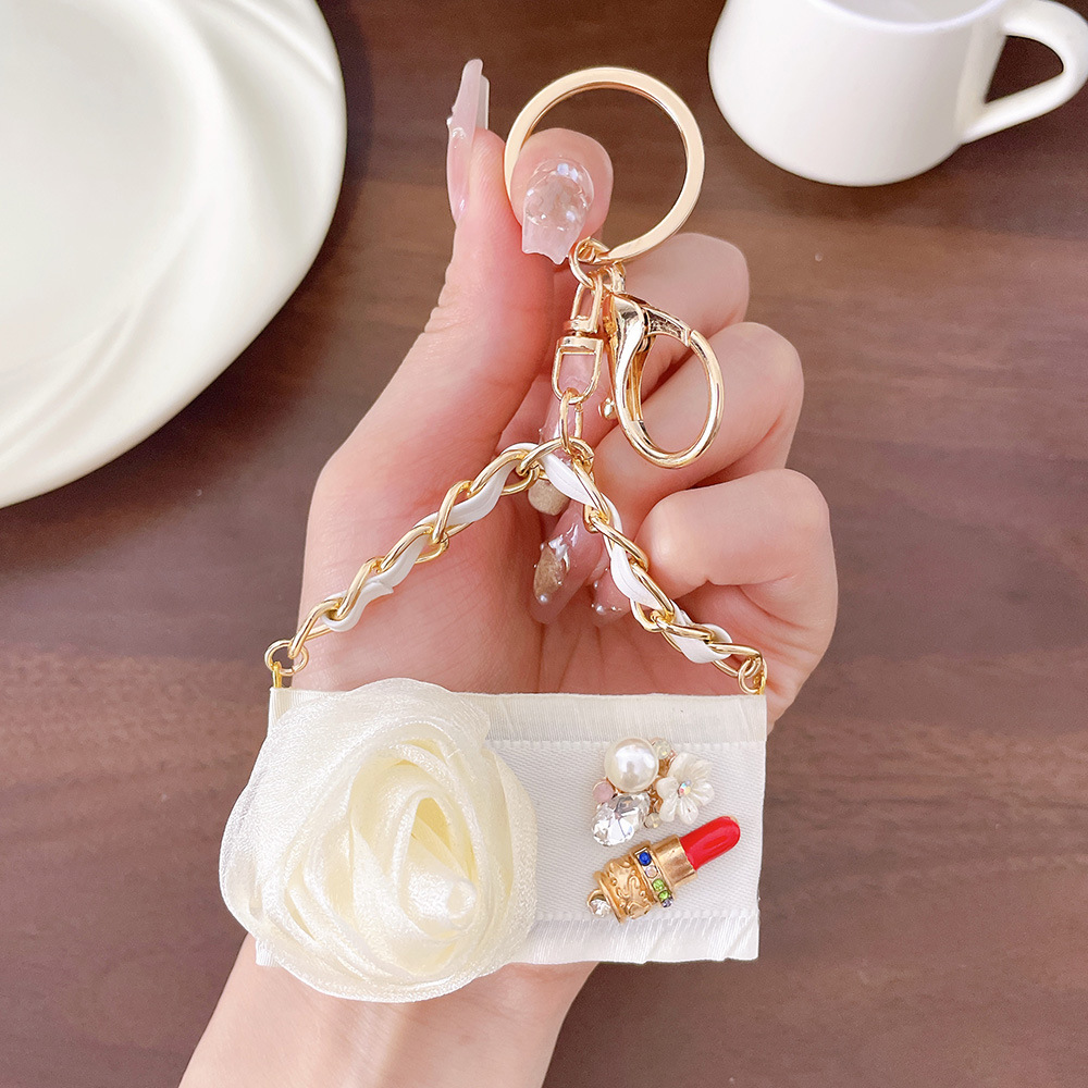 Luxury Camellia Flower Keychain with Bee Pearl Tassel Elegant Rose Gold Bag Charm Pendant Car Key Ring for Women Unique Gift Idea