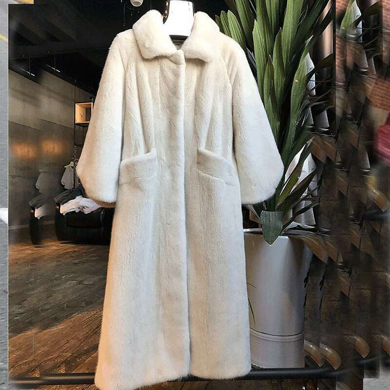 Women's Fashion In The Long White Black Fur Coat