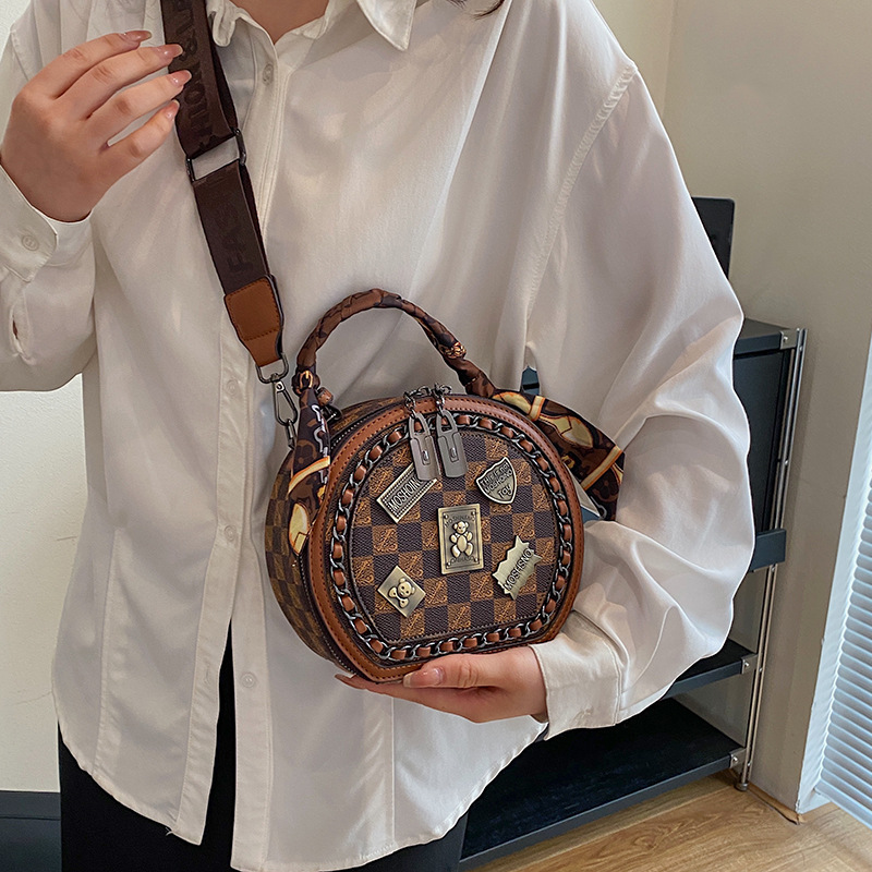 Free shipping designer bag Fashion women's small round bag 2025 new vintage printed handbag casual versatile single shoulder diagonal cross bag k
