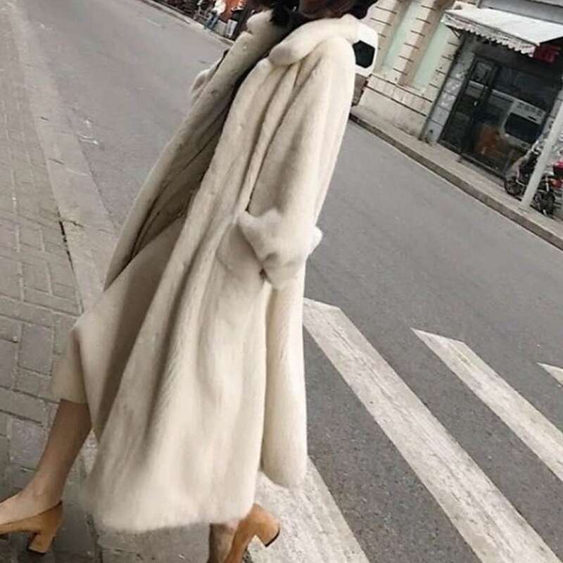 Women's Fashion In The Long White Black Fur Coat