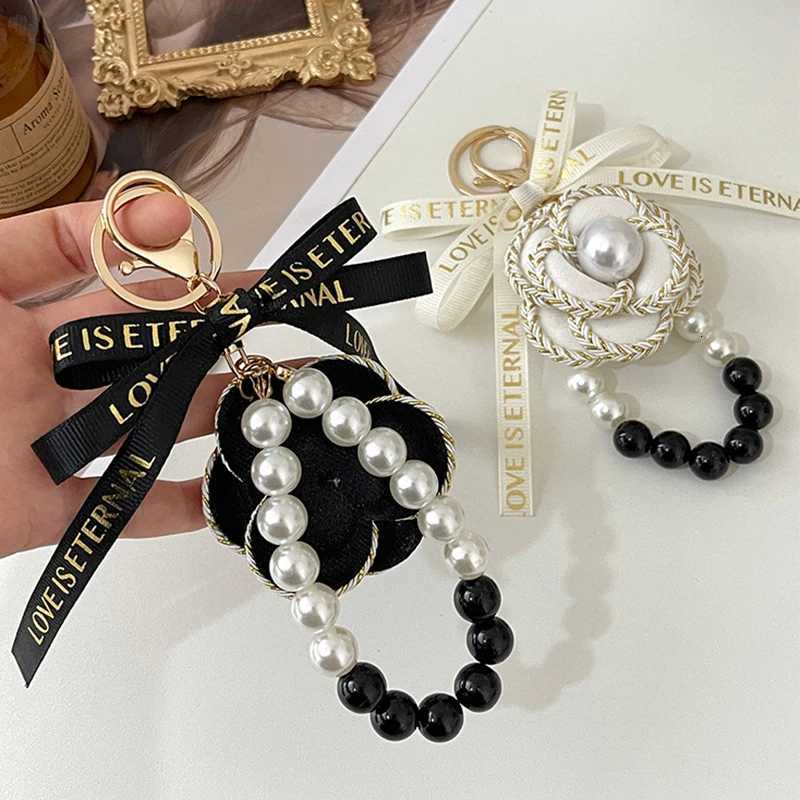 Korea Style Handmade Fabric Bow Tie Black White Pearl Chain Camellia Keychain Car Key Bag Charm Women Girl Keyring Gift Jewelry 1 S250910 AAS