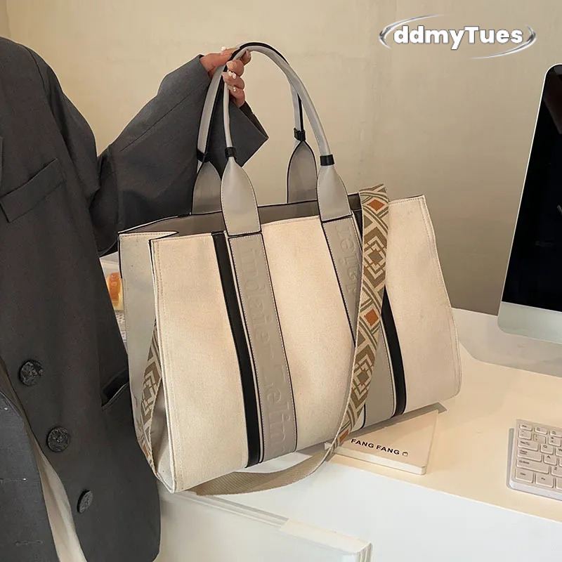 Large capacity hand-held canvas women's simple commuter tote with wide shoulder strap one-shoulder crossbody bag is versatile2025 TUES