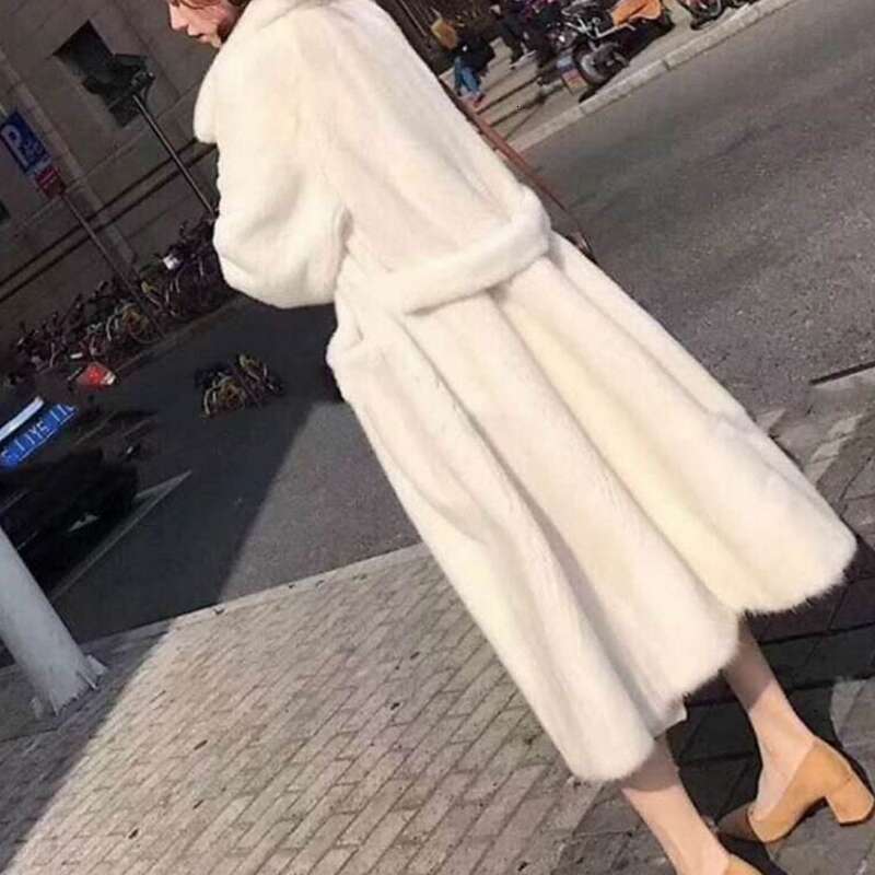 Women's Fashion In The Long White Black Fur Coat