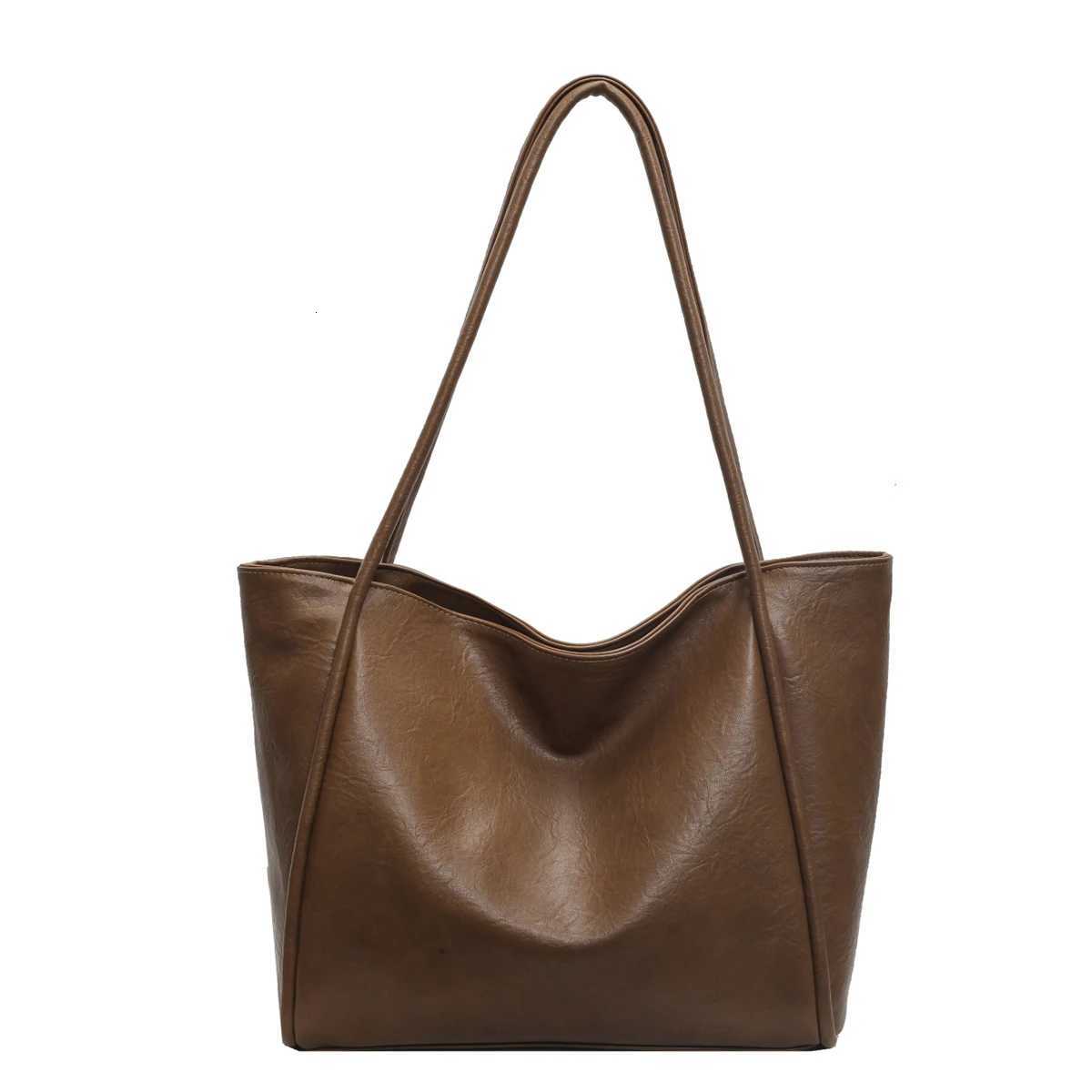New casual fashion trend large capacity tote bag French niche design daily versatile solid color shoulder bag Z250911