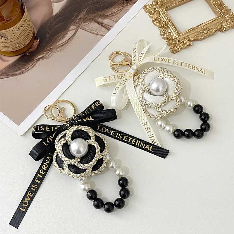 Korea Style Handmade Fabric Bow Tie Black White Pearl Chain Camellia Keychain Car Key Bag Charm Women Girl Keyring Gift Jewelry 1 S250910 AAS