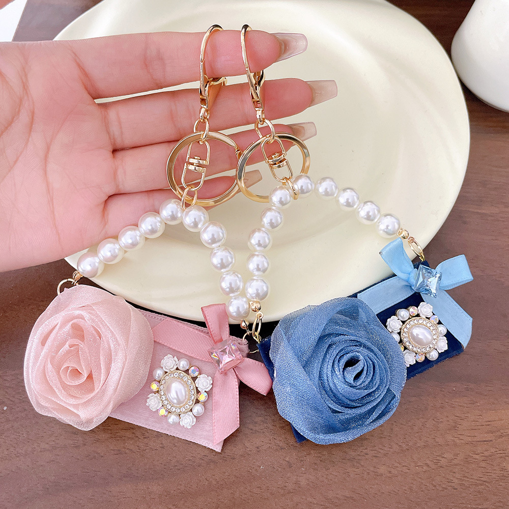Luxury Camellia Flower Keychain with Bee Pearl Tassel Elegant Rose Gold Bag Charm Pendant Car Key Ring for Women Unique Gift Idea